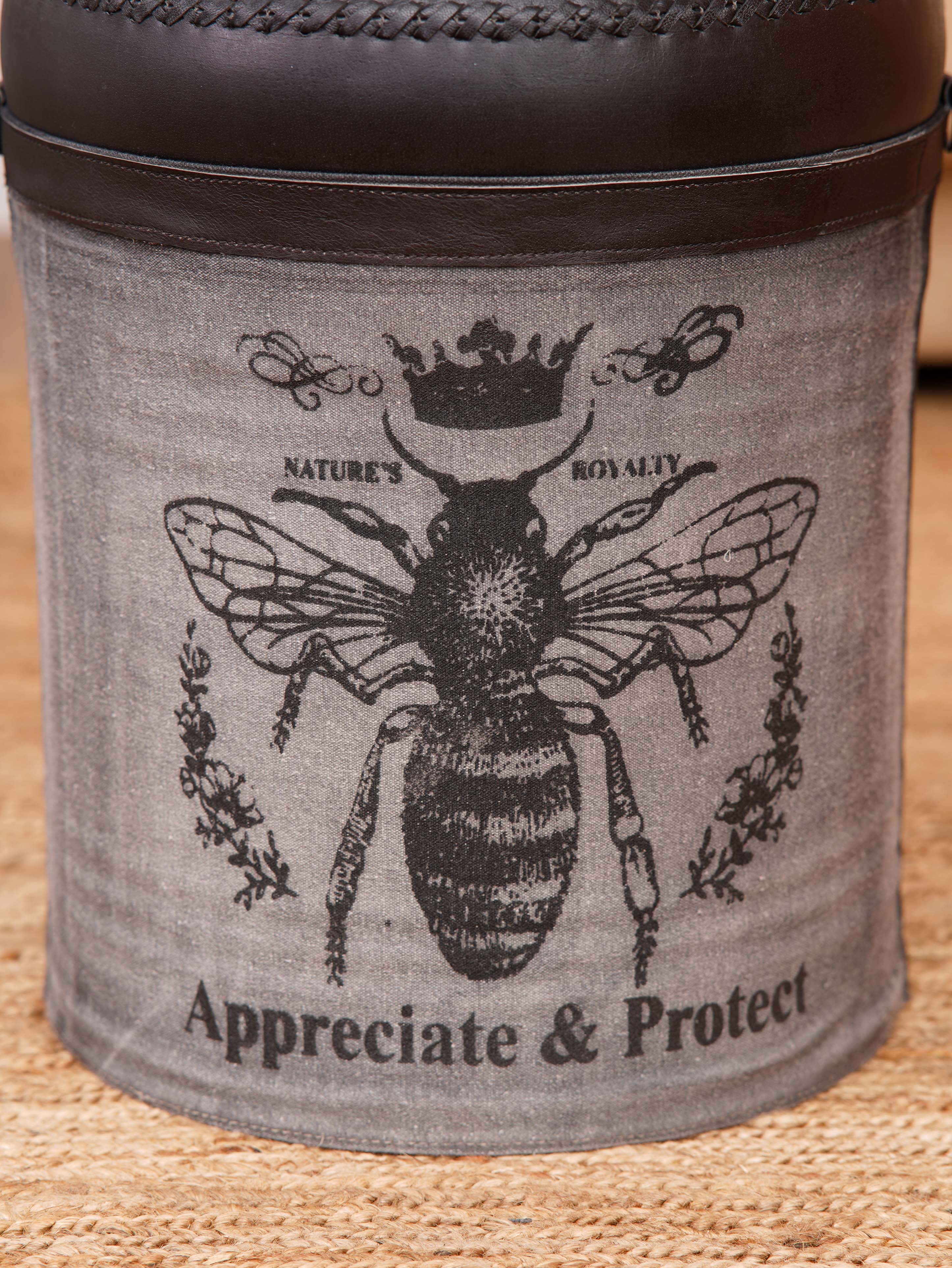 “Appreciate & Protect” bee graphic on canvas ottoman panel