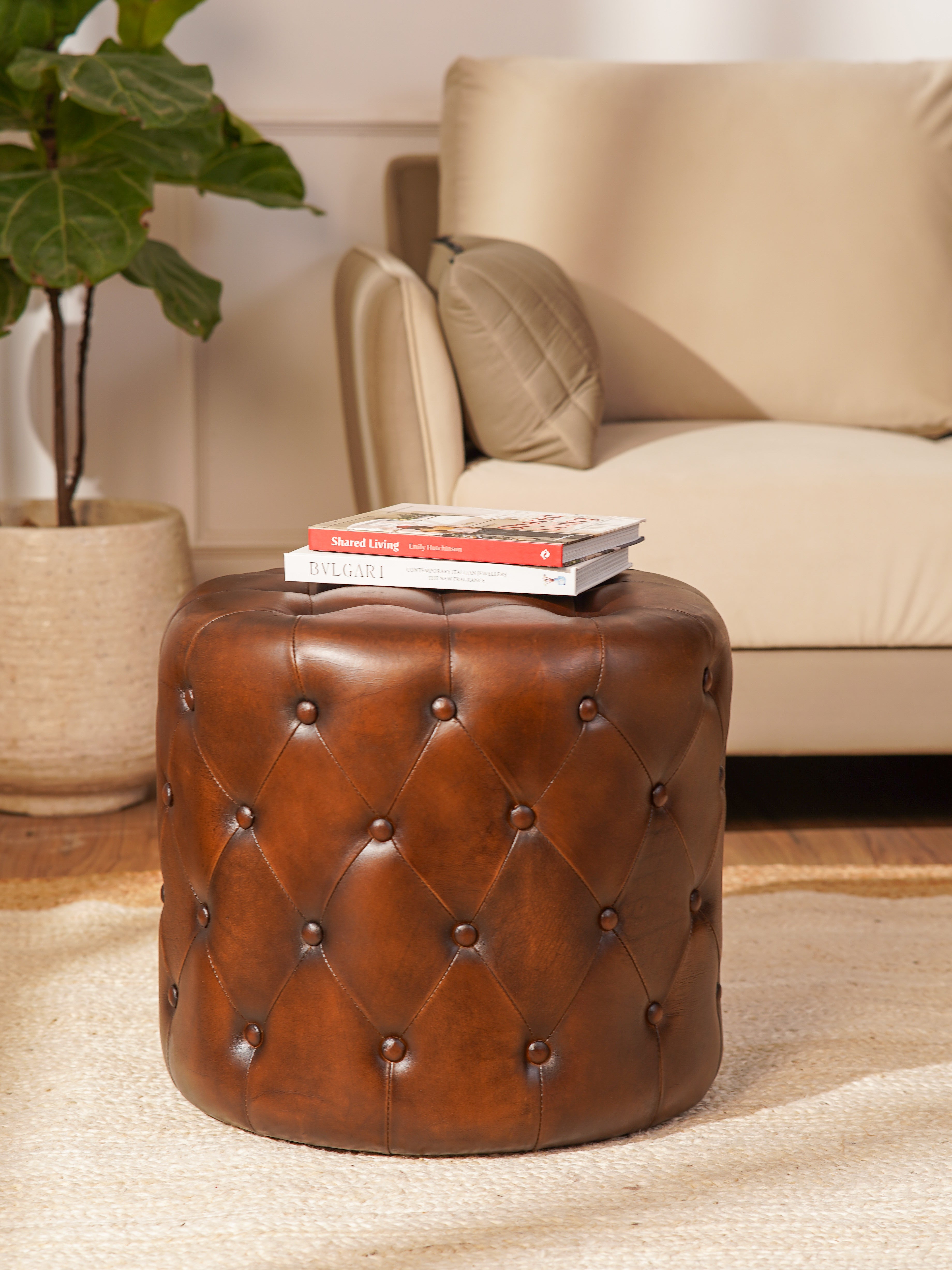 The Regal Repose – Round Tufted Leather Ottoman with Solid Wood Frame
