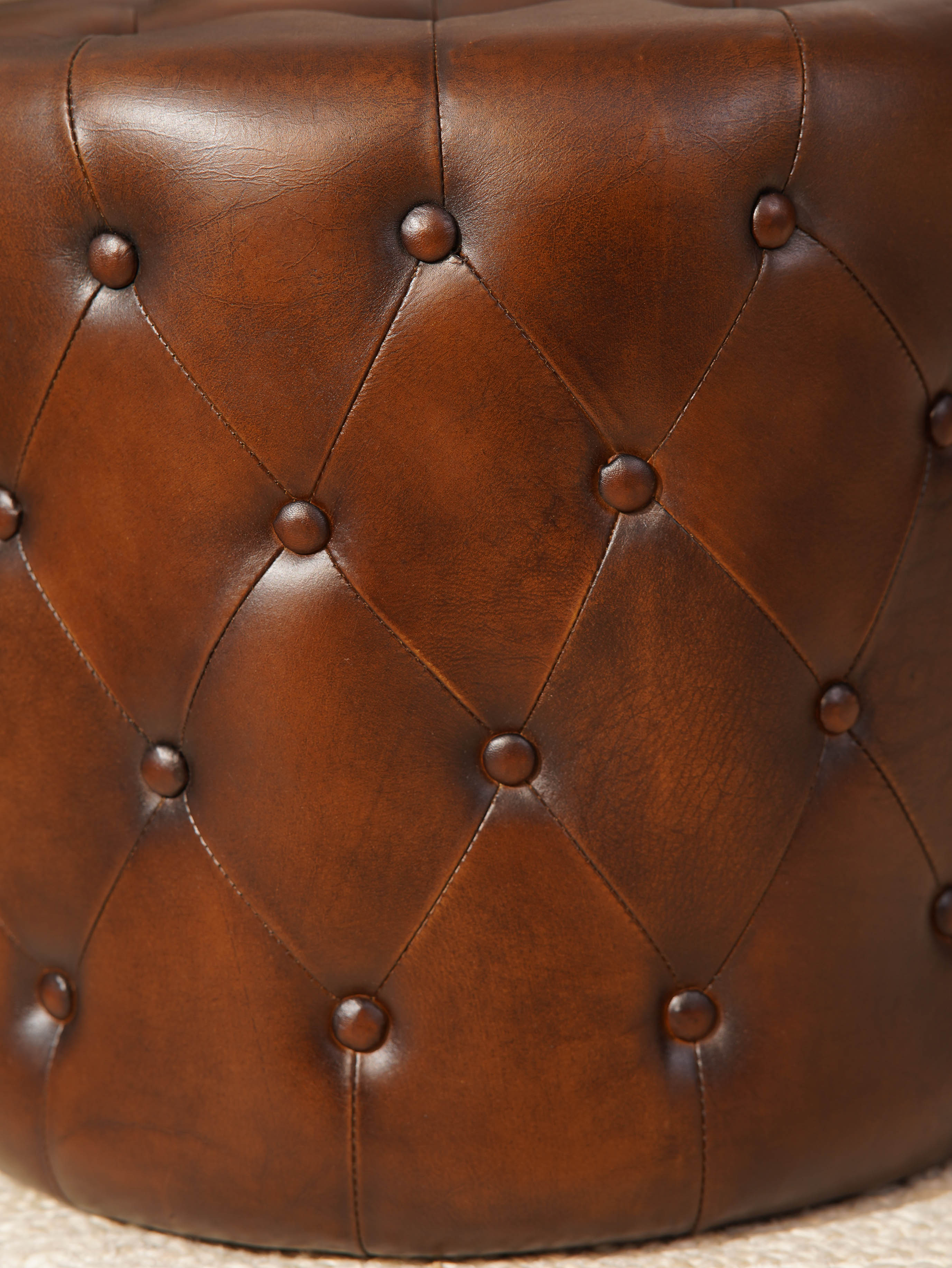 The Regal Repose – Round Tufted Leather Ottoman with Solid Wood Frame