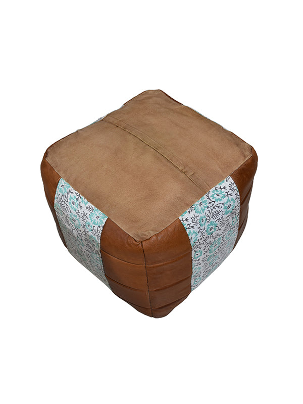 Top-down view of handmade pouf showing canvas patchwork design
upside down.