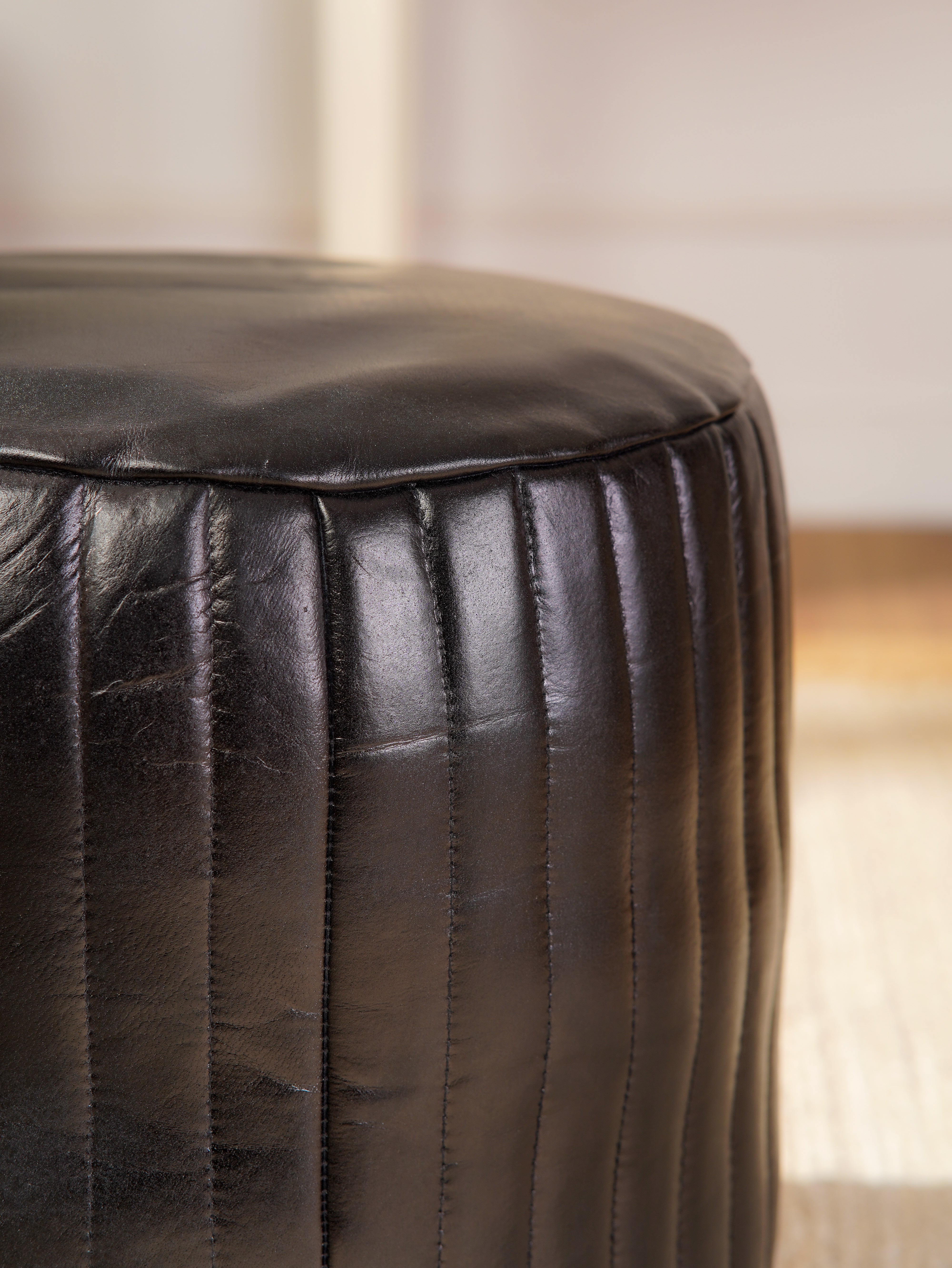 Round Buffalo Leather Pouf โ Eclipse Ottoman | Handmade | Black | Filled