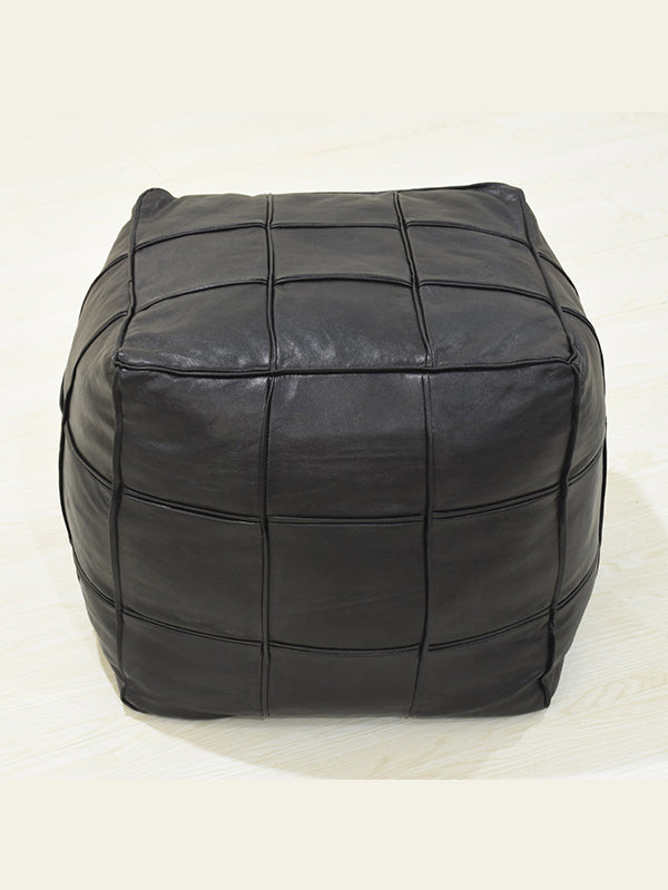Handmade leather pouf in black with stitched square panels