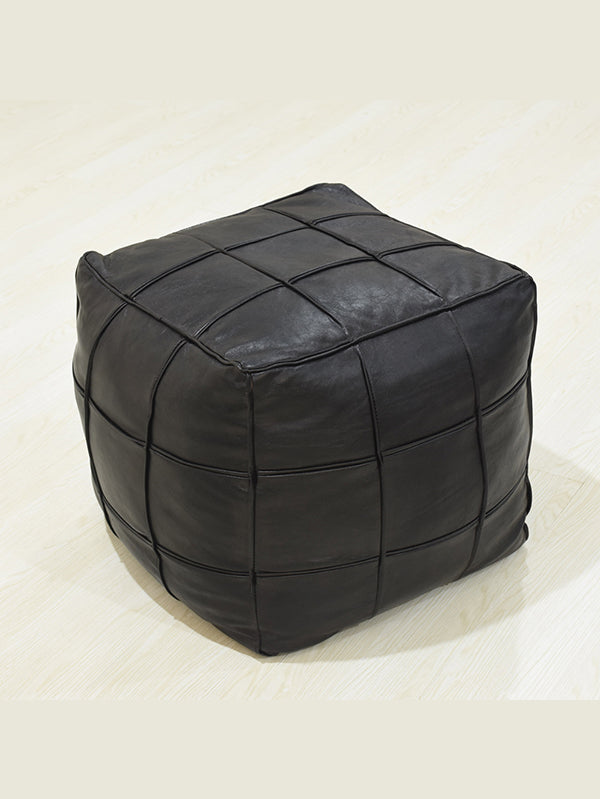 Handmade leather pouf in black with stitched square panels