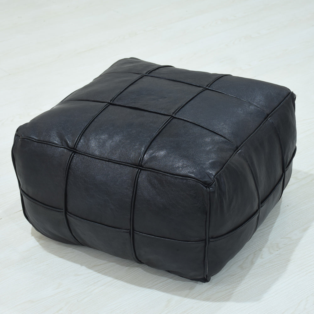 Handmade leather pouf in black with stitched square panels