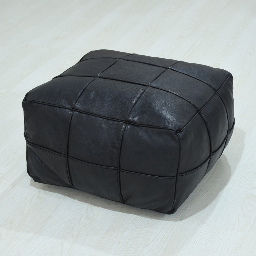 Handmade leather pouf in black with stitched square panels