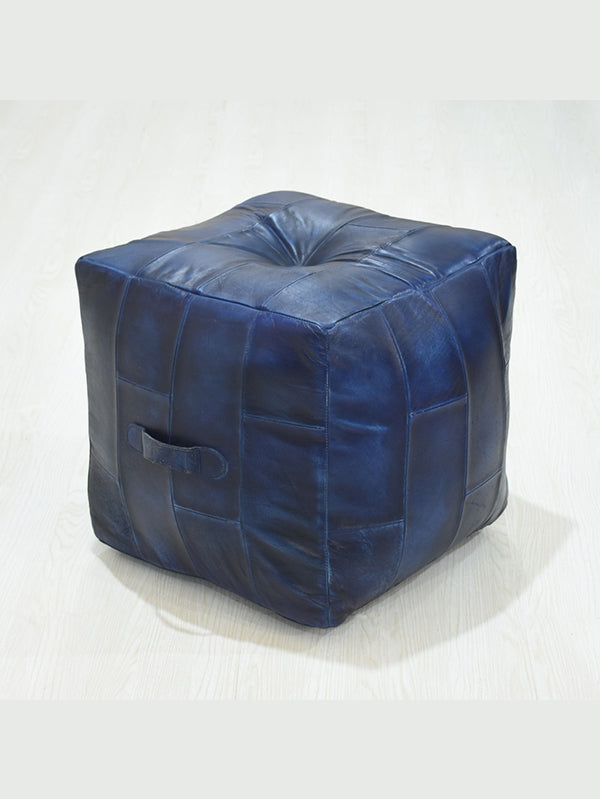 Top-down view of filled square pouf with rich blue leather finish