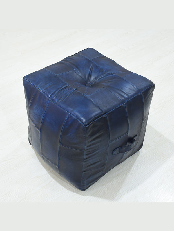 Top-down view of filled square pouf with rich blue leather finish