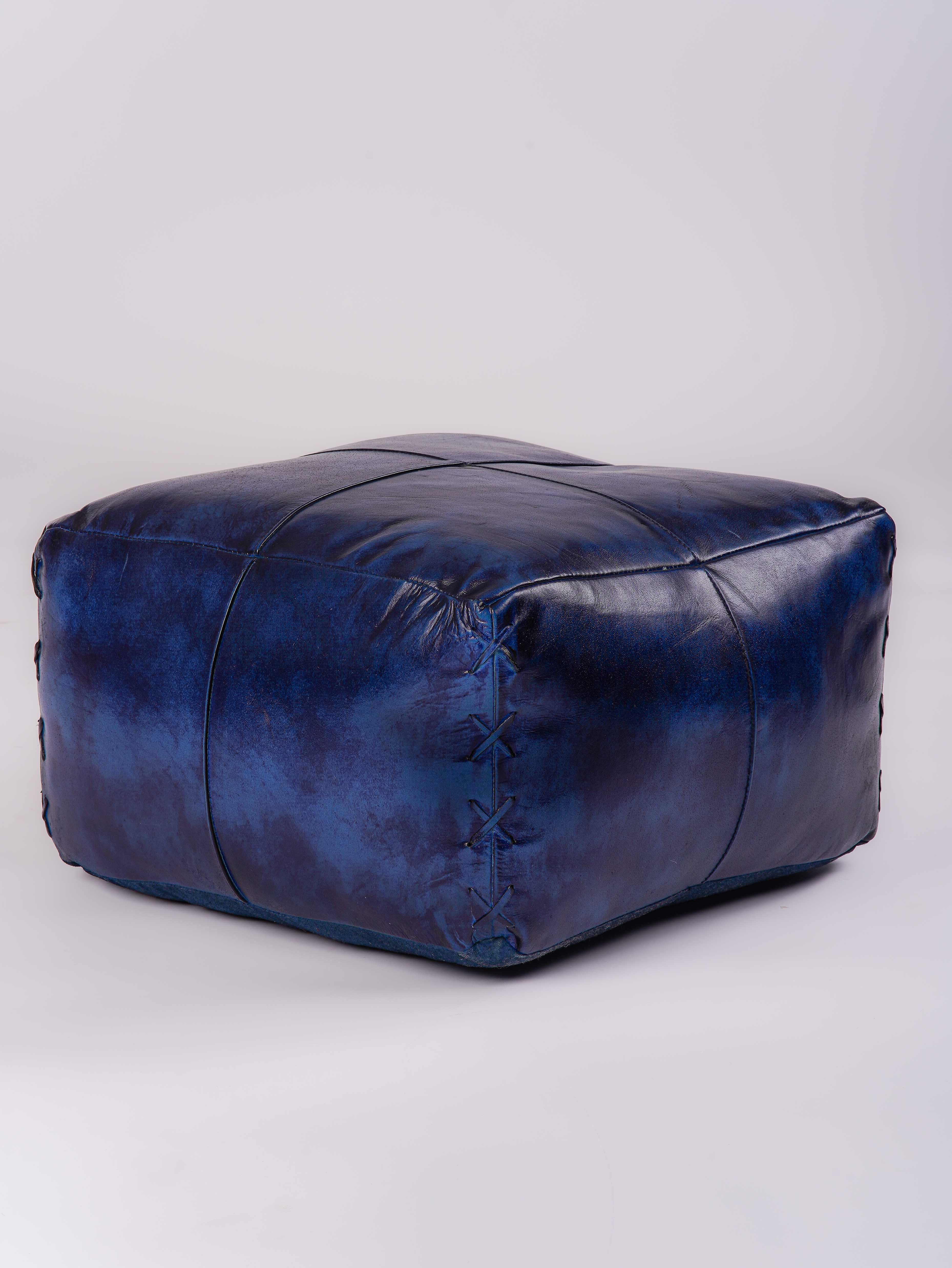 Vintage blue pouf in milled buffalo leather with stitched detailing