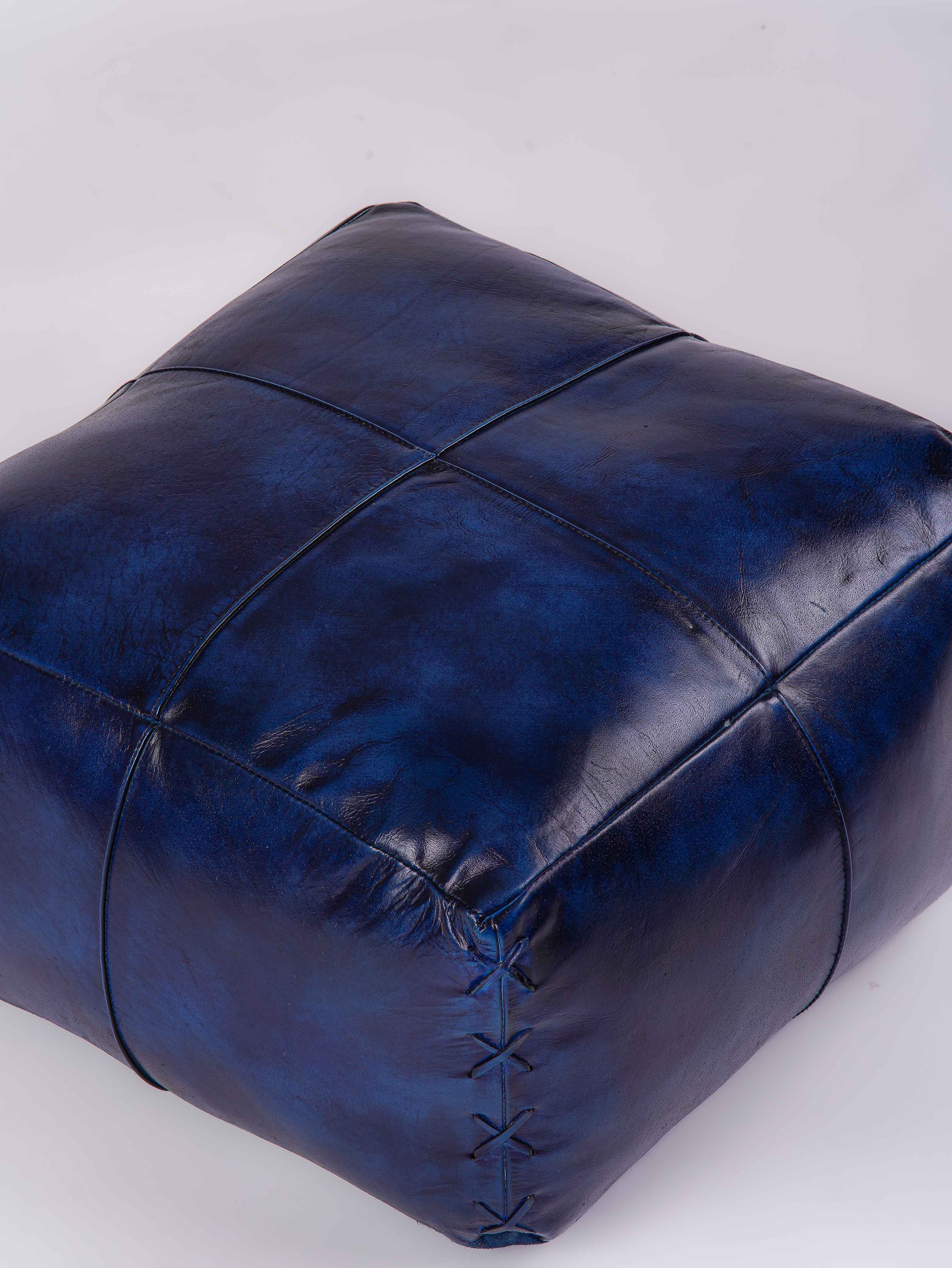 Top-down view of handmade blue leather pouf