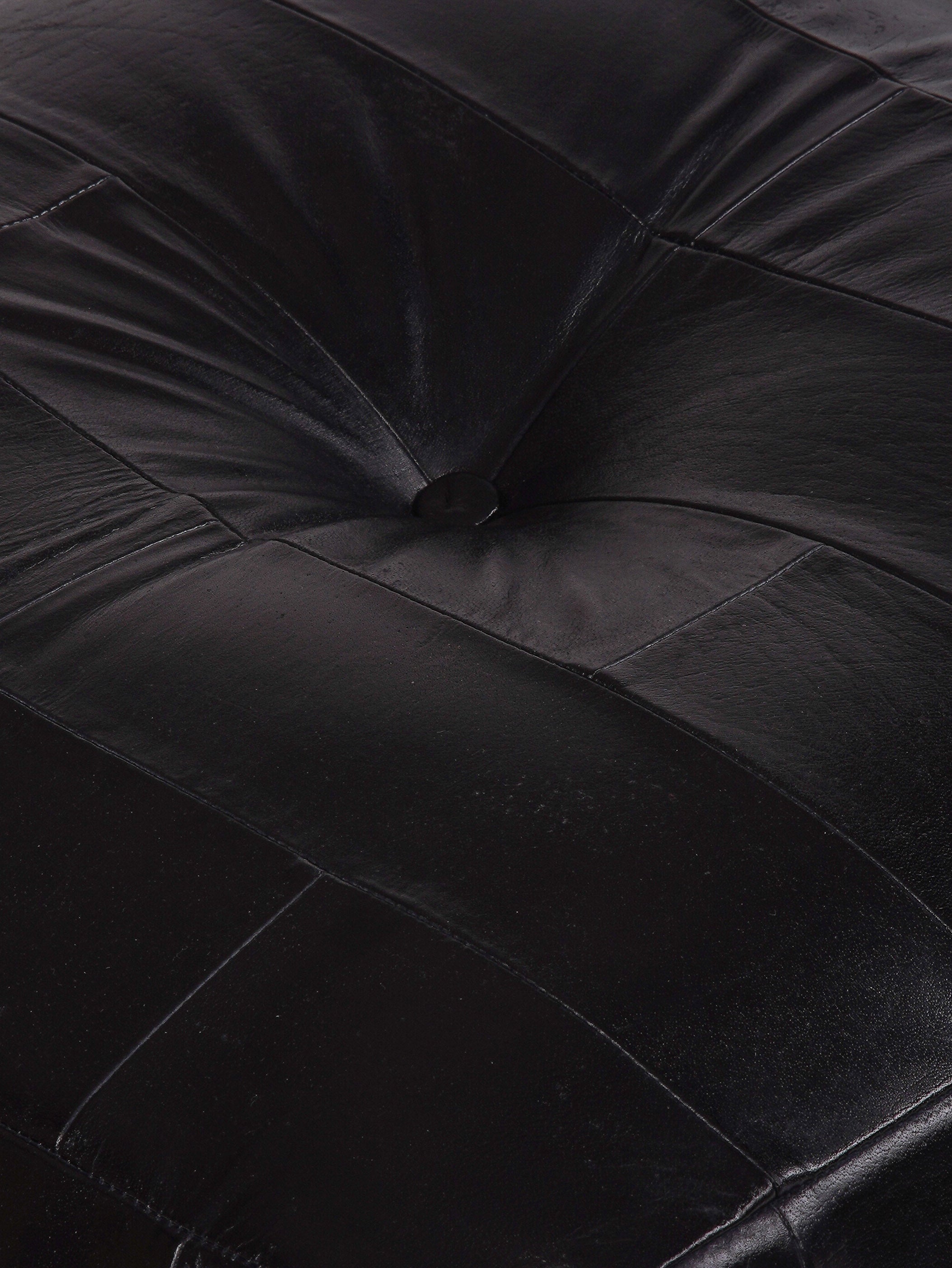 Buffalo leather texture and stitching on black square pouf