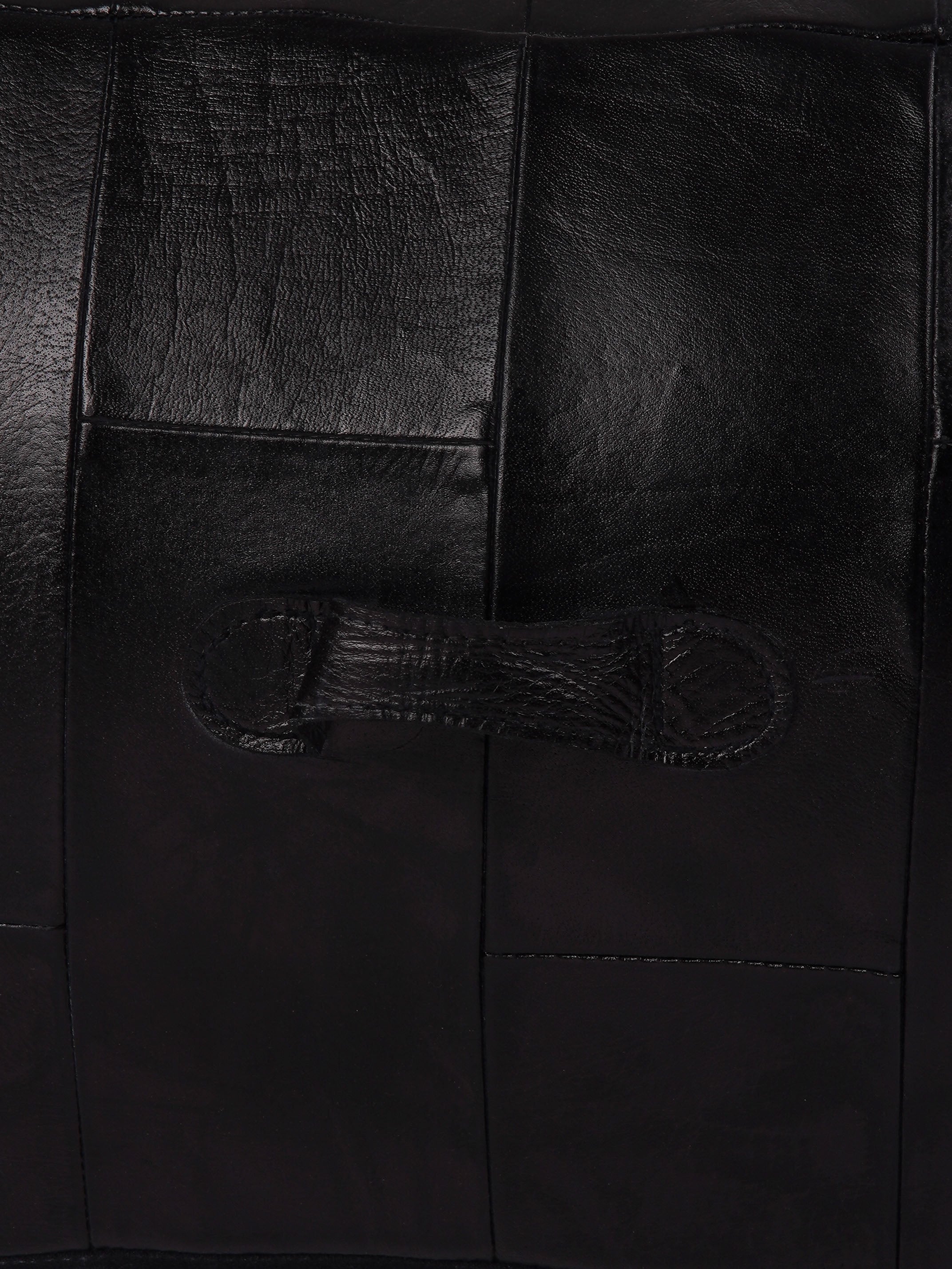 Buffalo leather texture and stitching on black square pouf