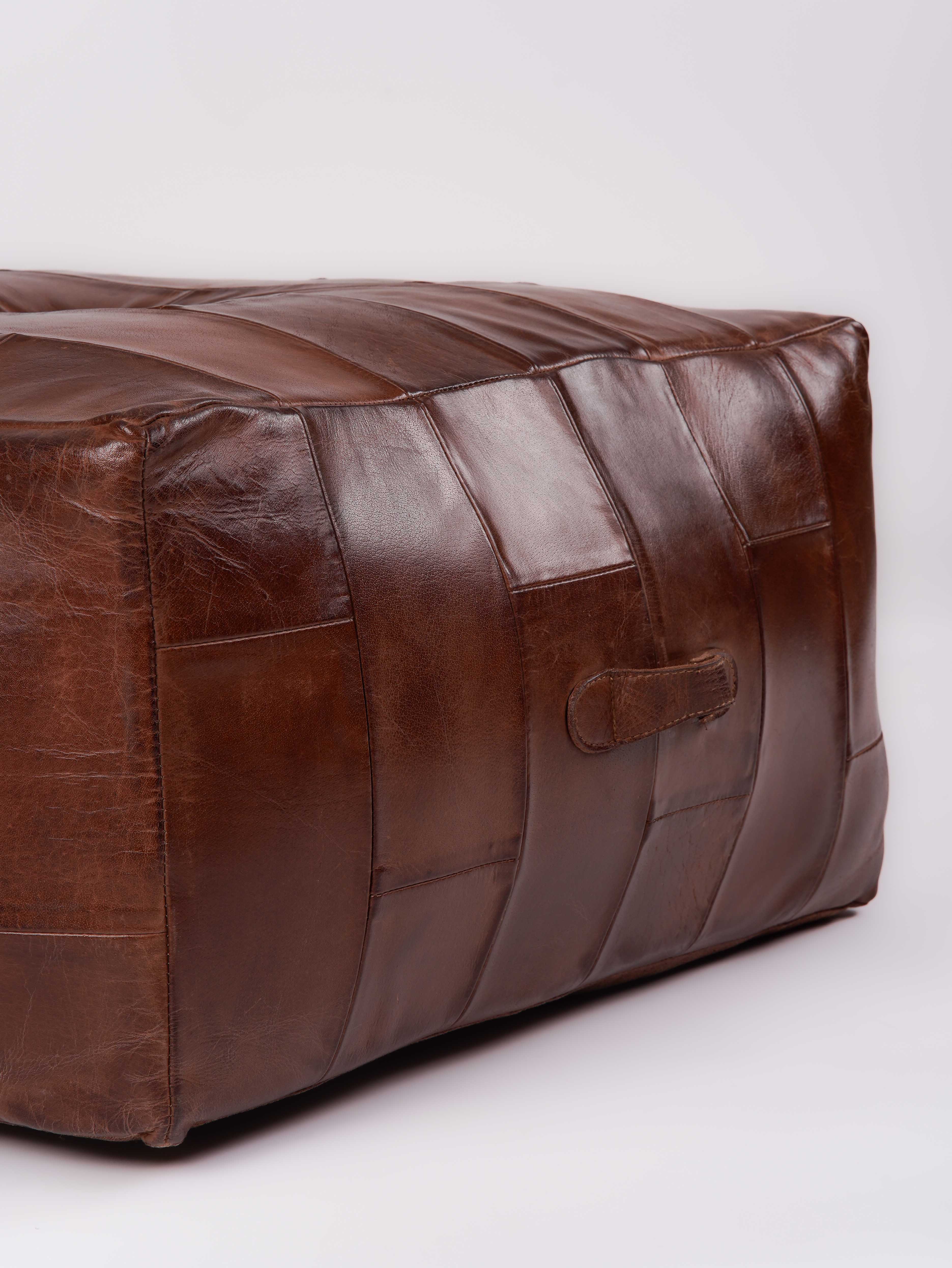 Structured square pouf ottoman in genuine leather on jute rug