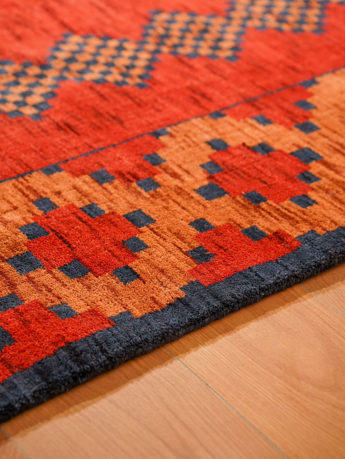 Rust Ember Tribal Hand-Knotted Wool Rug with Indigo Geometric Panel Design