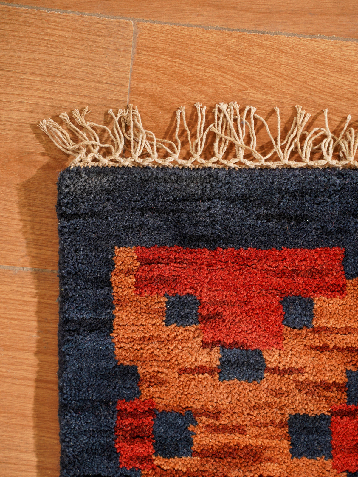Rust Ember Tribal Hand-Knotted Wool Rug with Indigo Geometric Panel Design