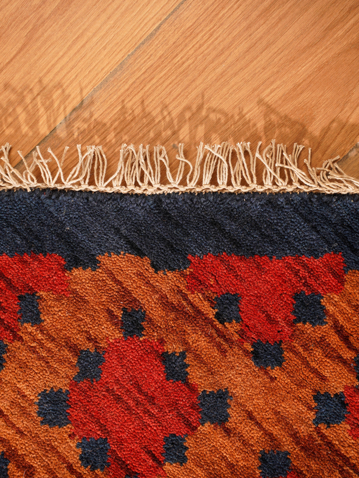 Rust Ember Tribal Hand-Knotted Wool Rug with Indigo Geometric Panel Design