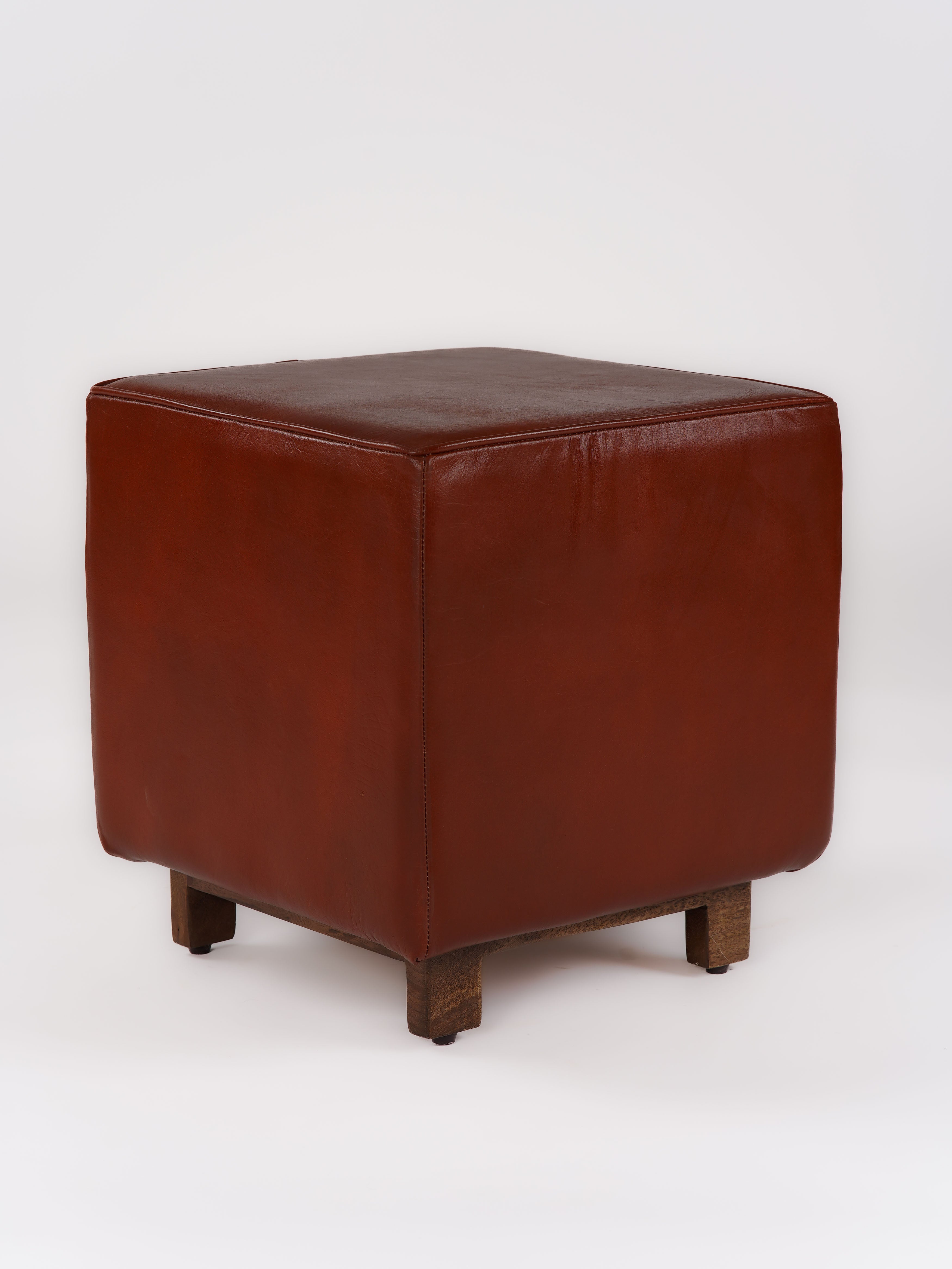 Profile of square stool with stitched buffalo leather upholstery in brown