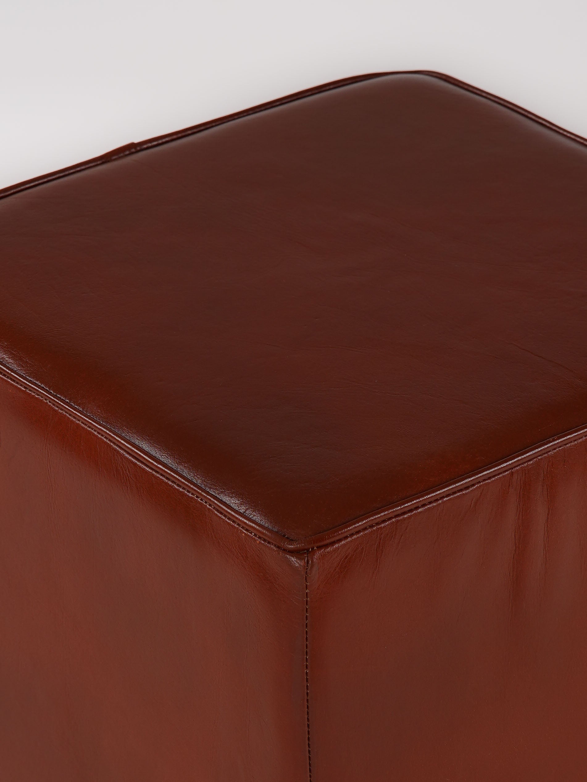 Close-up of top stitching and leather grain on The Esquire Rest stool