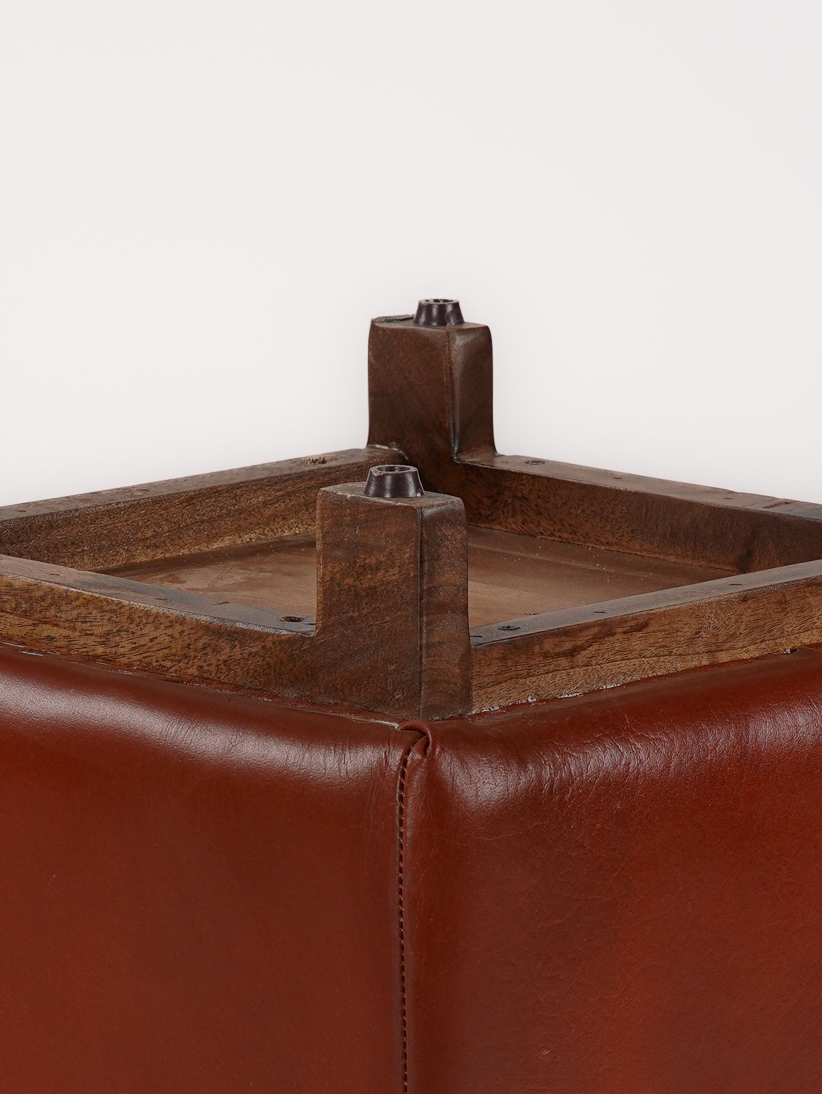 Close-up of top stitching and leather grain on The Esquire Rest stool