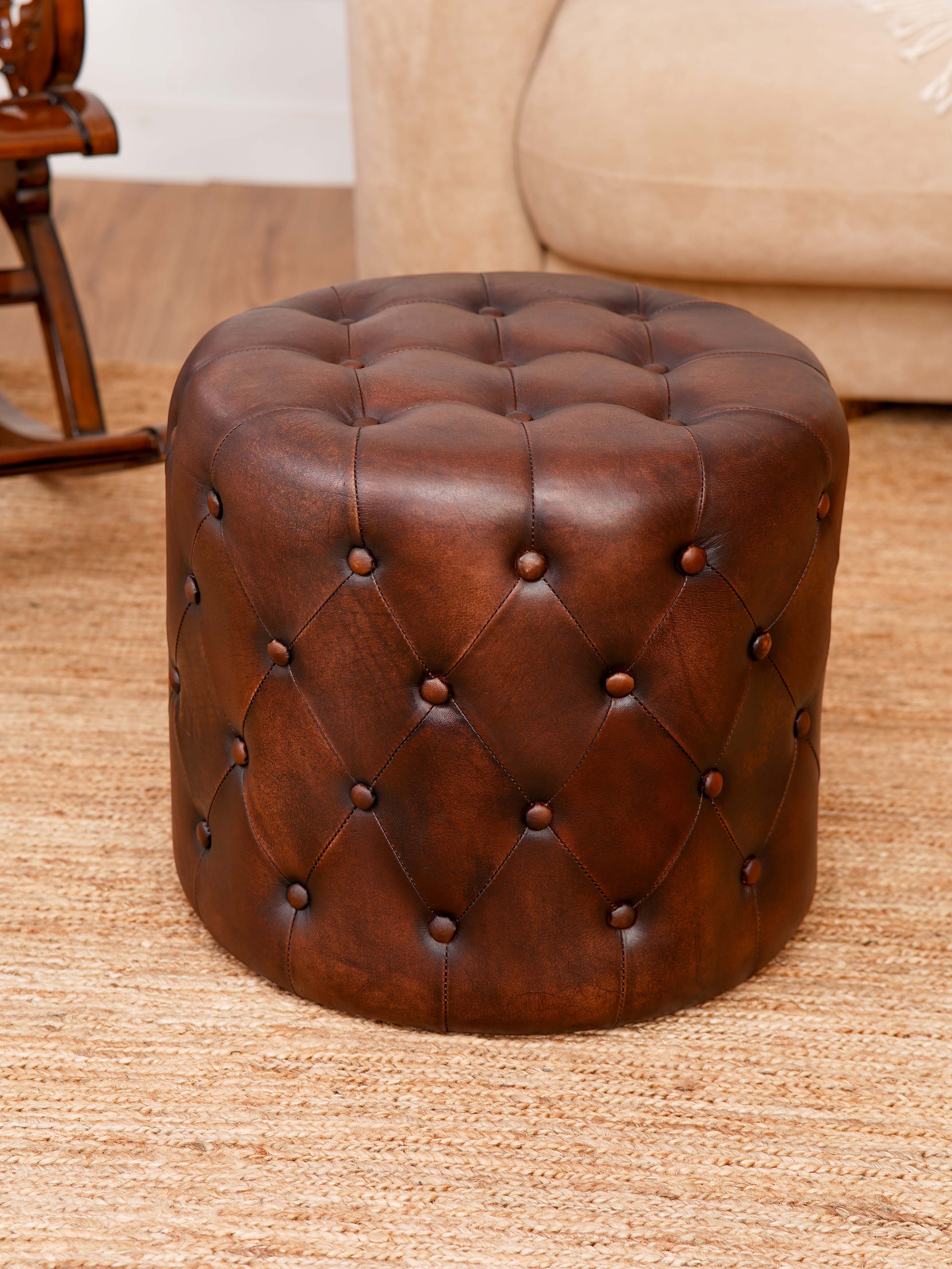 The Regal Repose – Round Tufted Leather Ottoman with Solid Wood Frame