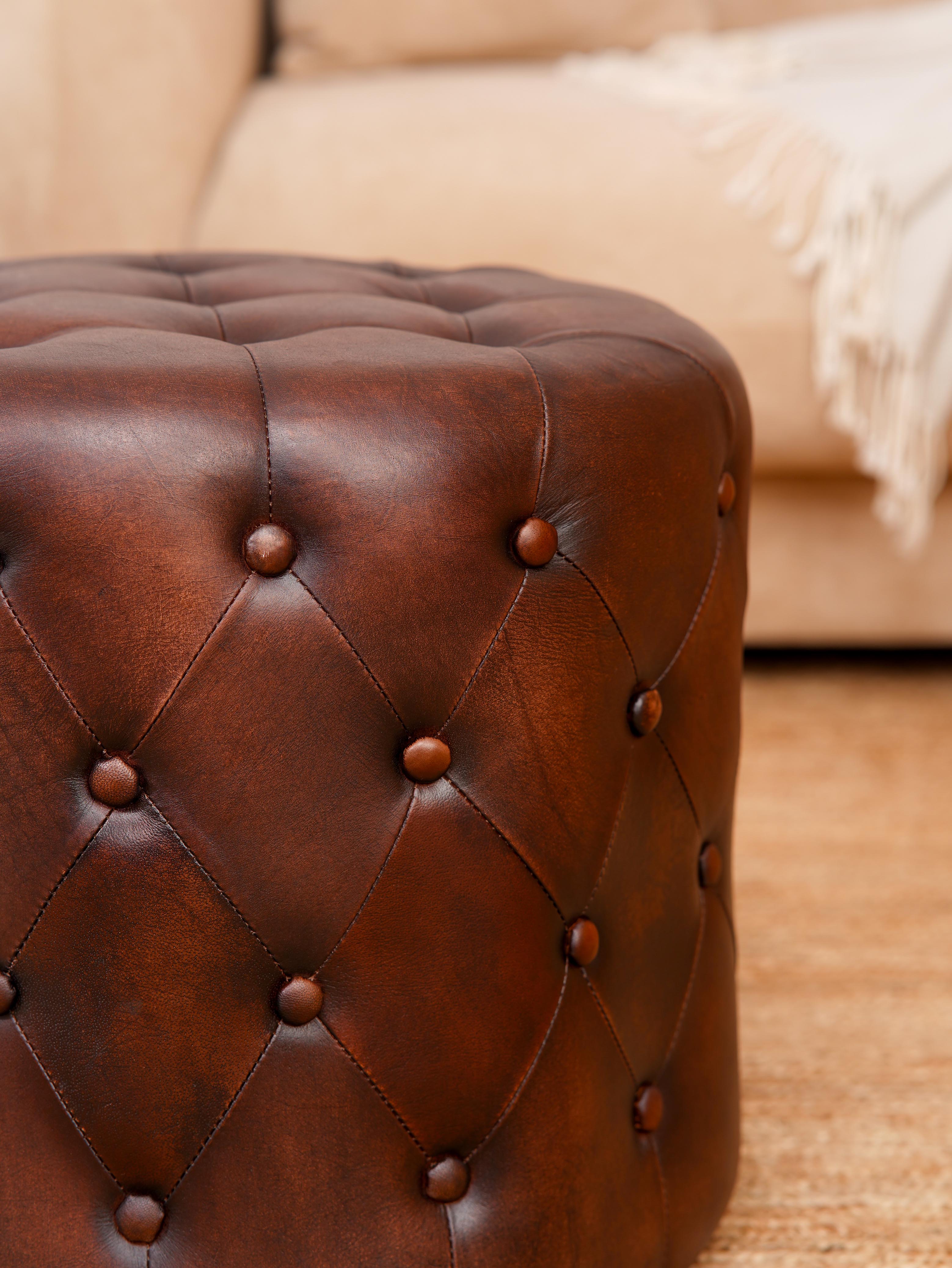 The Regal Repose – Round Tufted Leather Ottoman with Solid Wood Frame