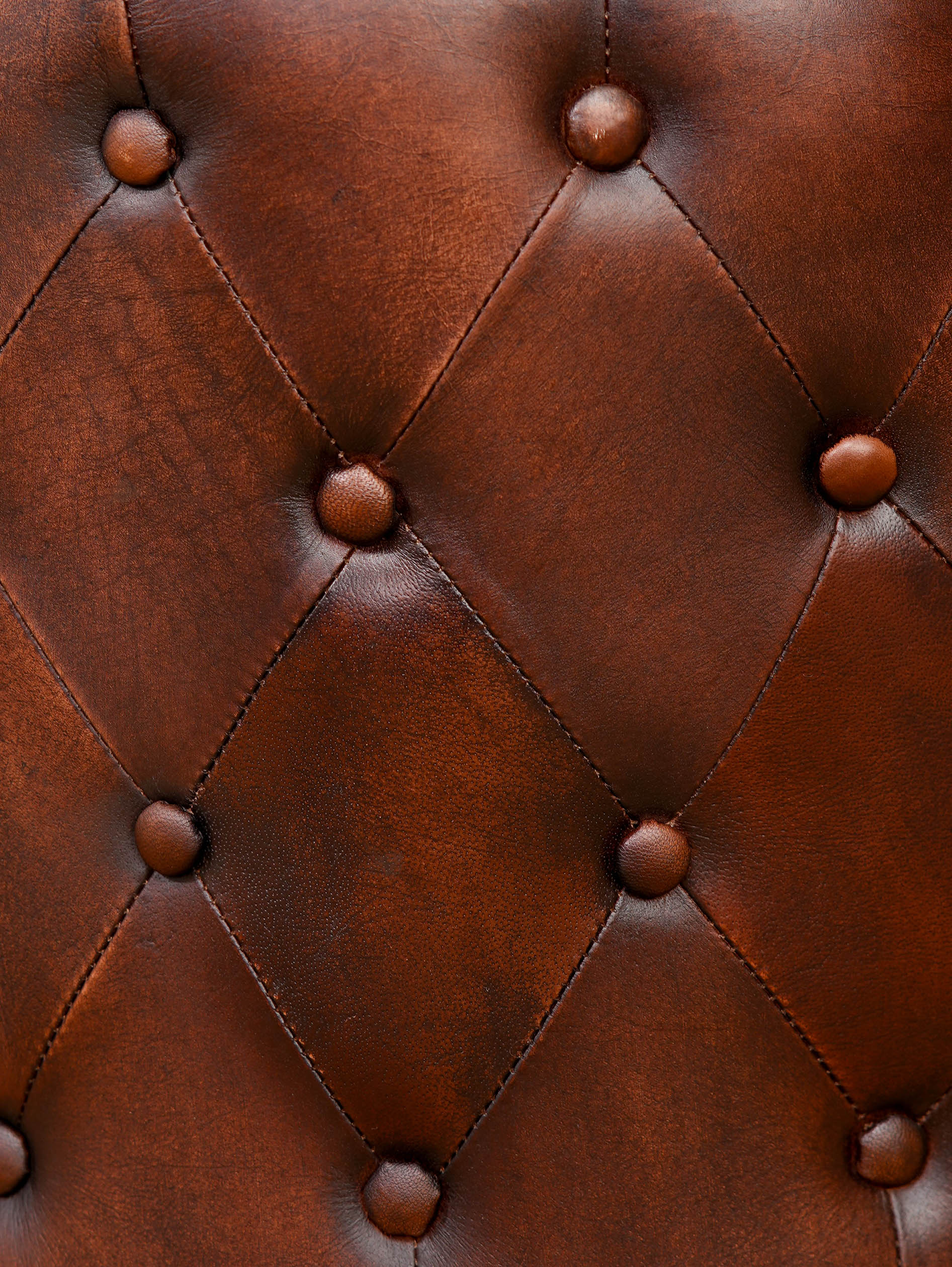 The Regal Repose – Round Tufted Leather Ottoman with Solid Wood Frame