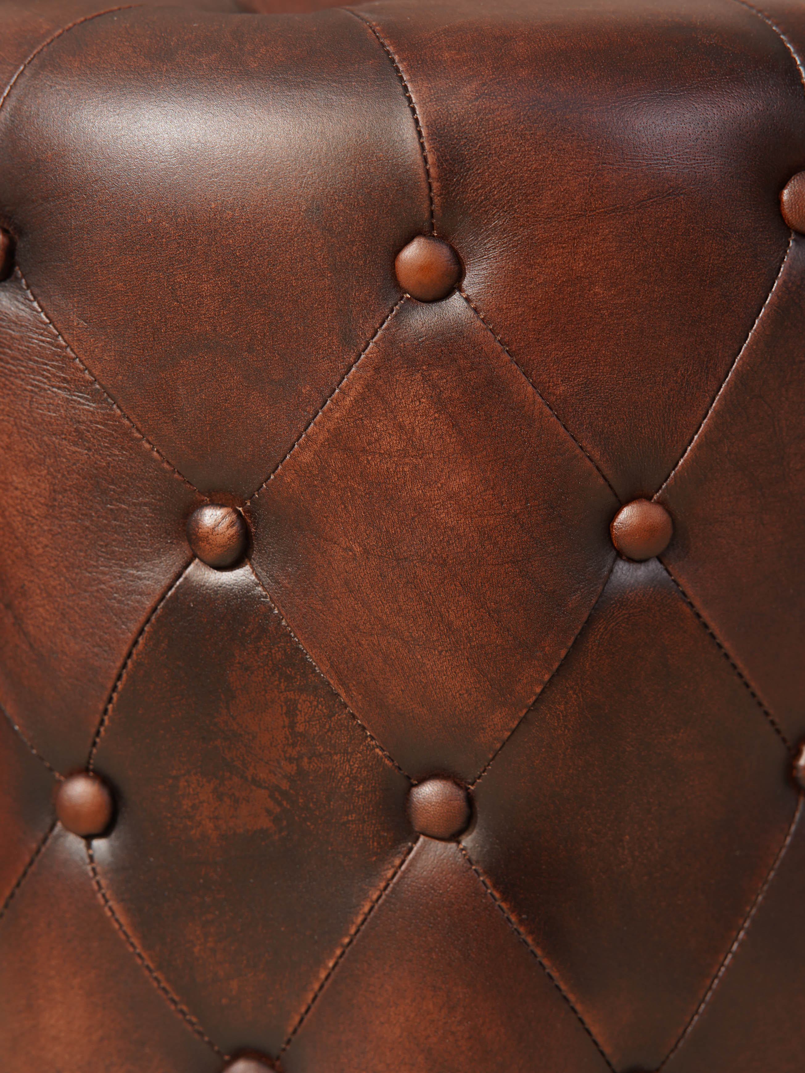 The Regal Repose – Round Tufted Leather Ottoman with Solid Wood Frame