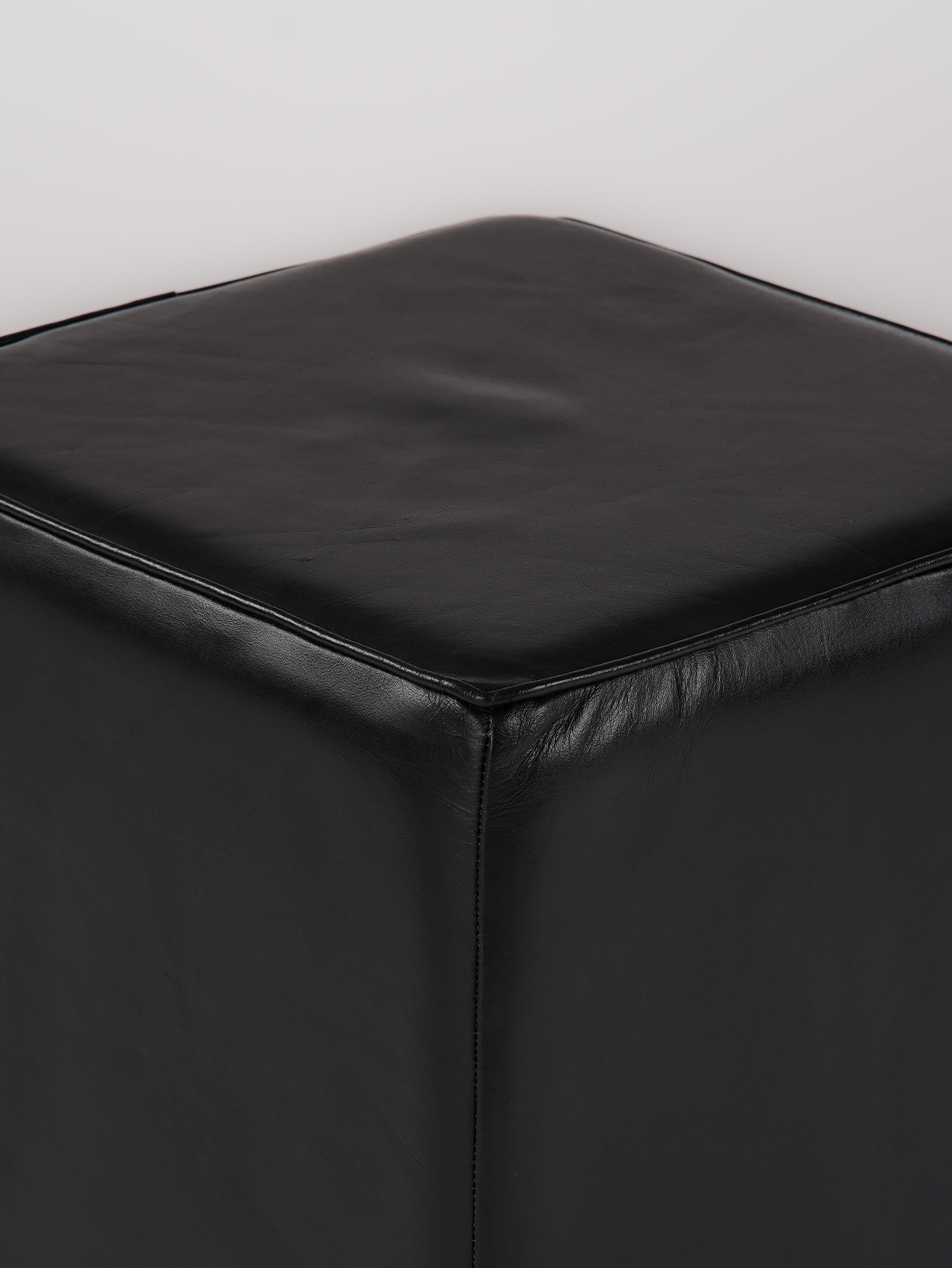 Close-up of top stitching and leather grain on The Esquire Rest stool