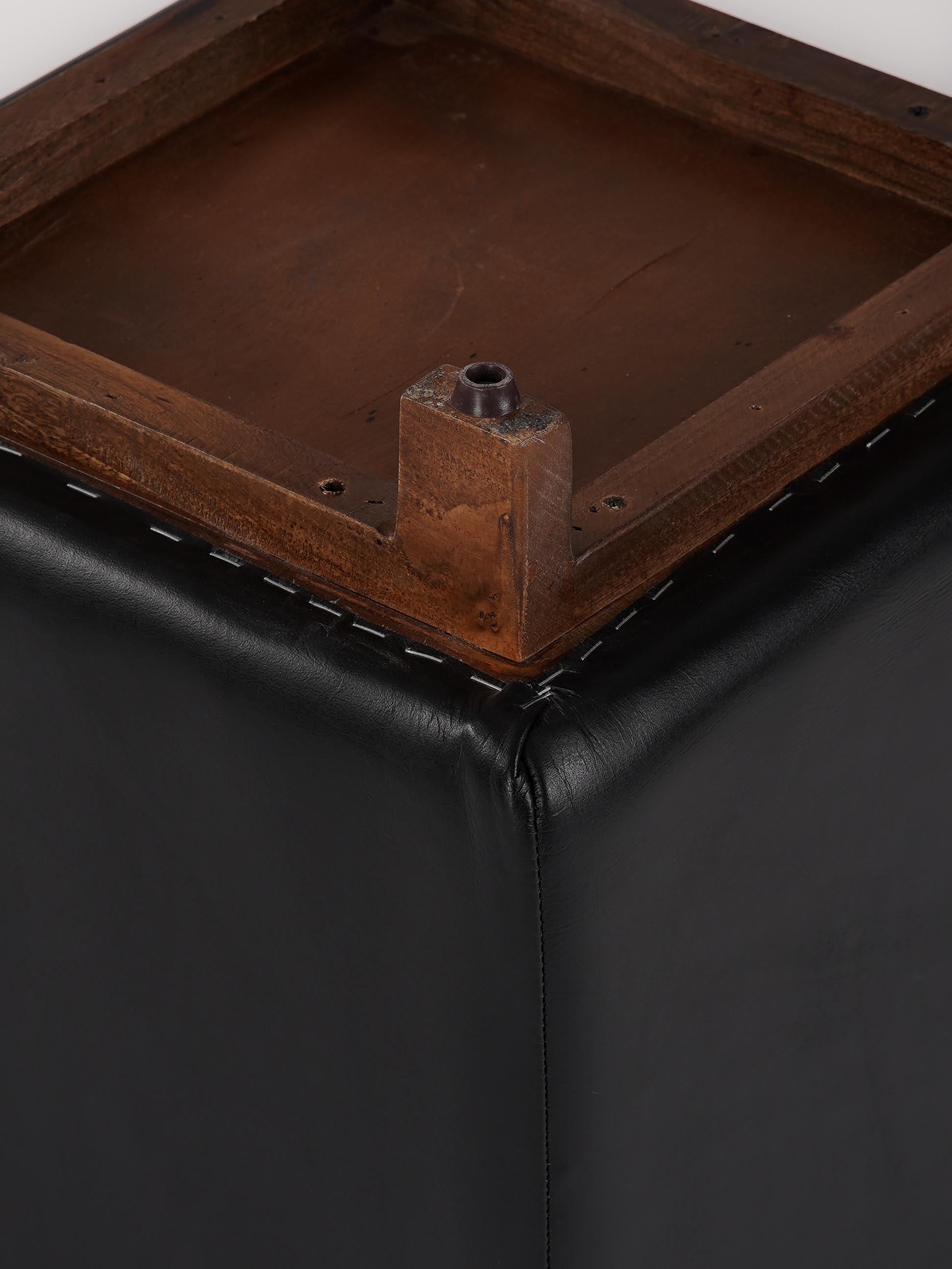 Close-up of top stitching and leather grain on The Esquire Rest stool