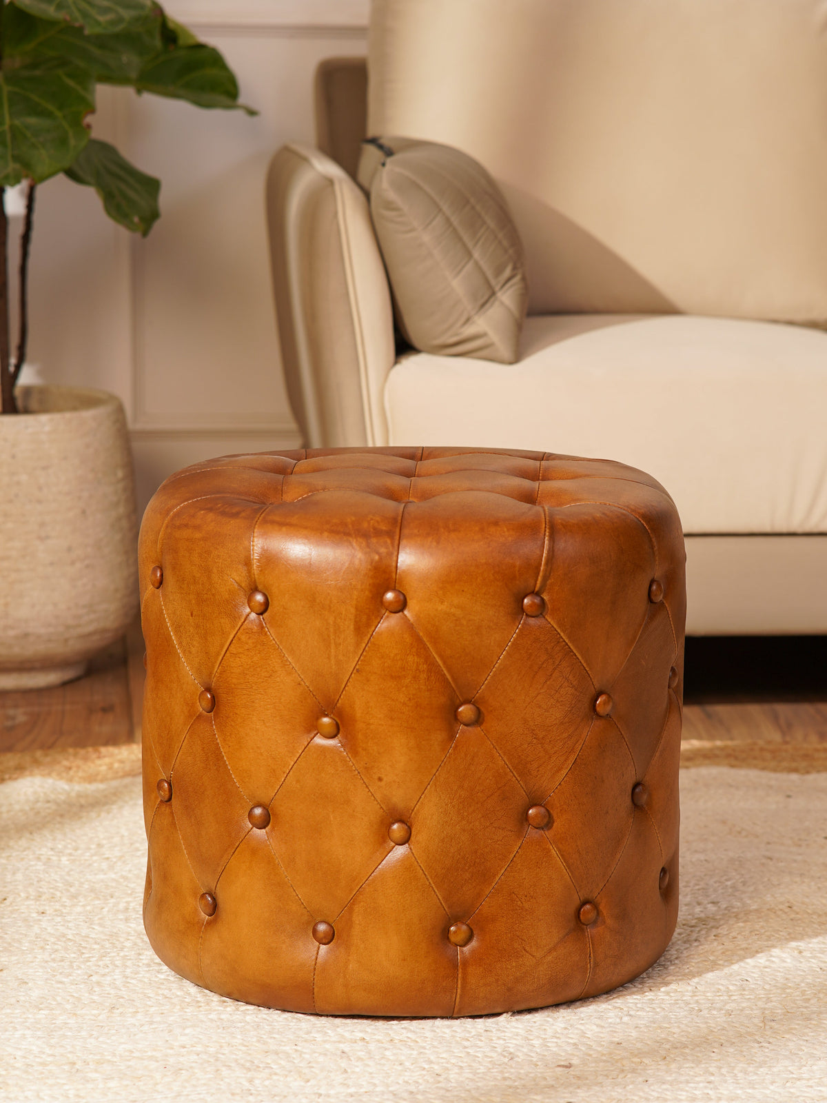 The Regal Repose – Round Tufted Leather Ottoman with Solid Wood Frame