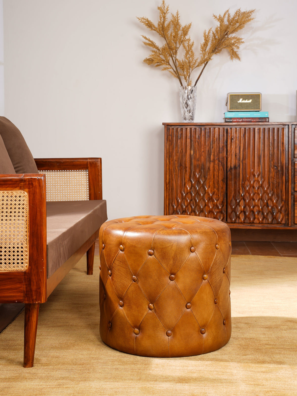 The Regal Repose – Round Tufted Leather Ottoman with Solid Wood Frame