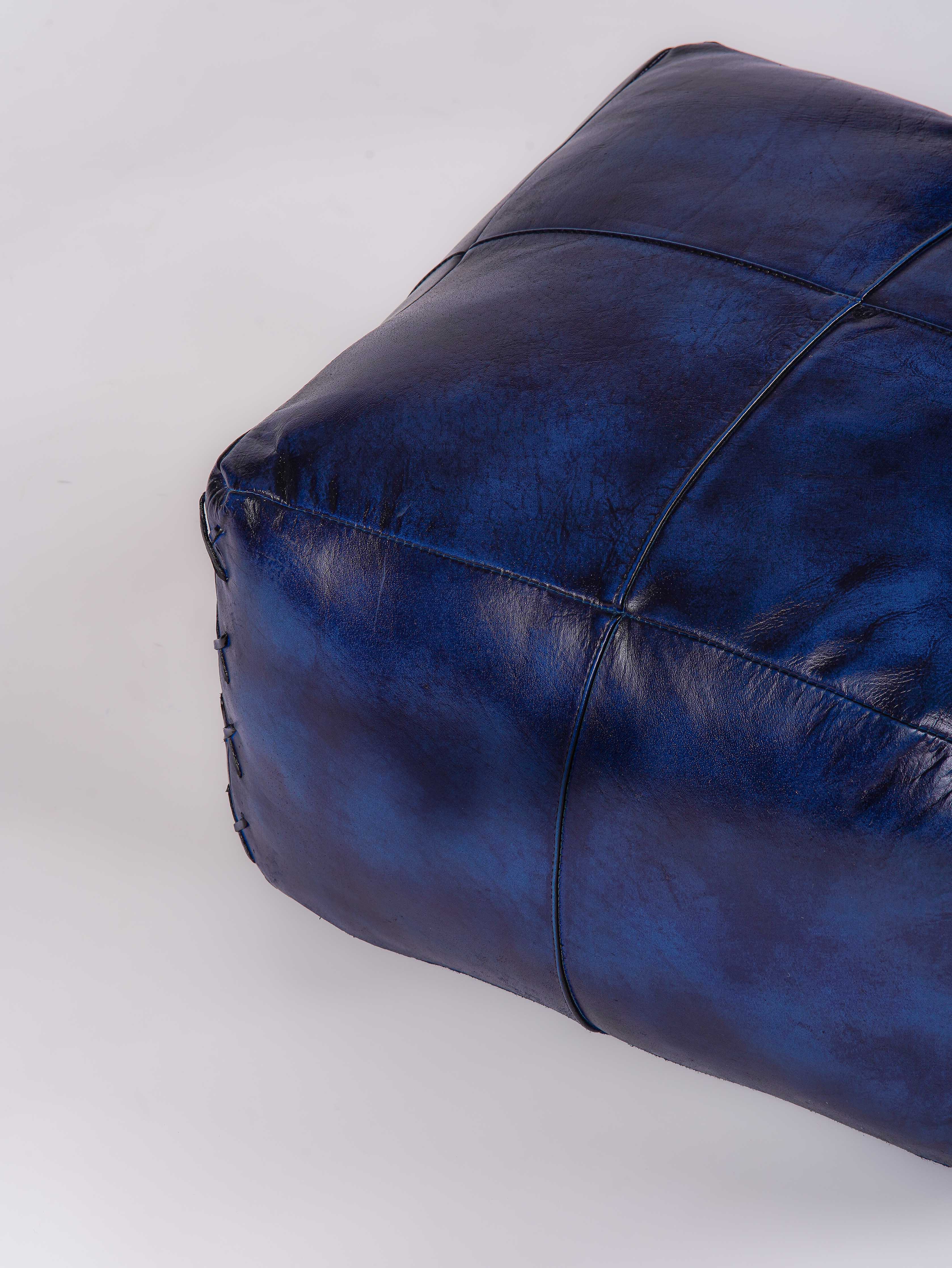 Top-down view of handmade blue leather pouf
