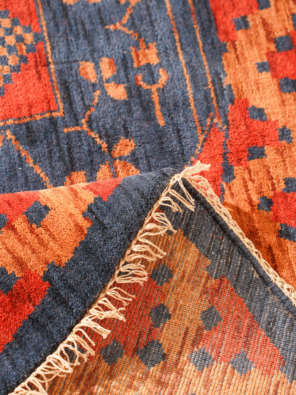 Rust Ember Tribal Hand-Knotted Wool Rug with Indigo Geometric Panel Design