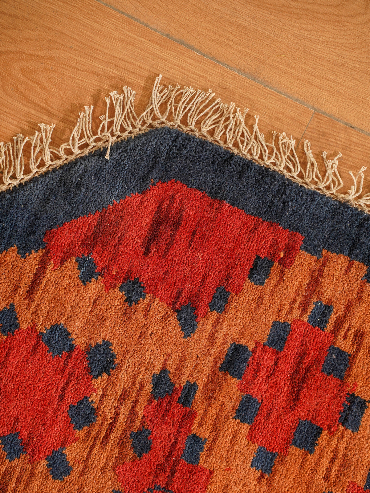 Rust Ember Tribal Hand-Knotted Wool Rug with Indigo Geometric Panel Design