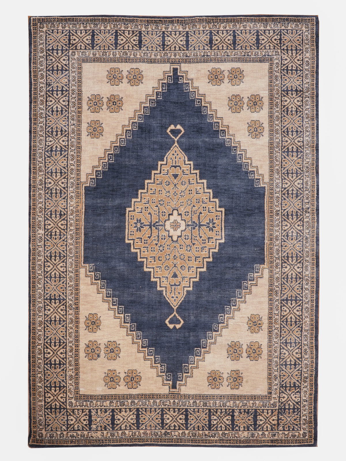 Decorative rug with geometric pattern on a plain background