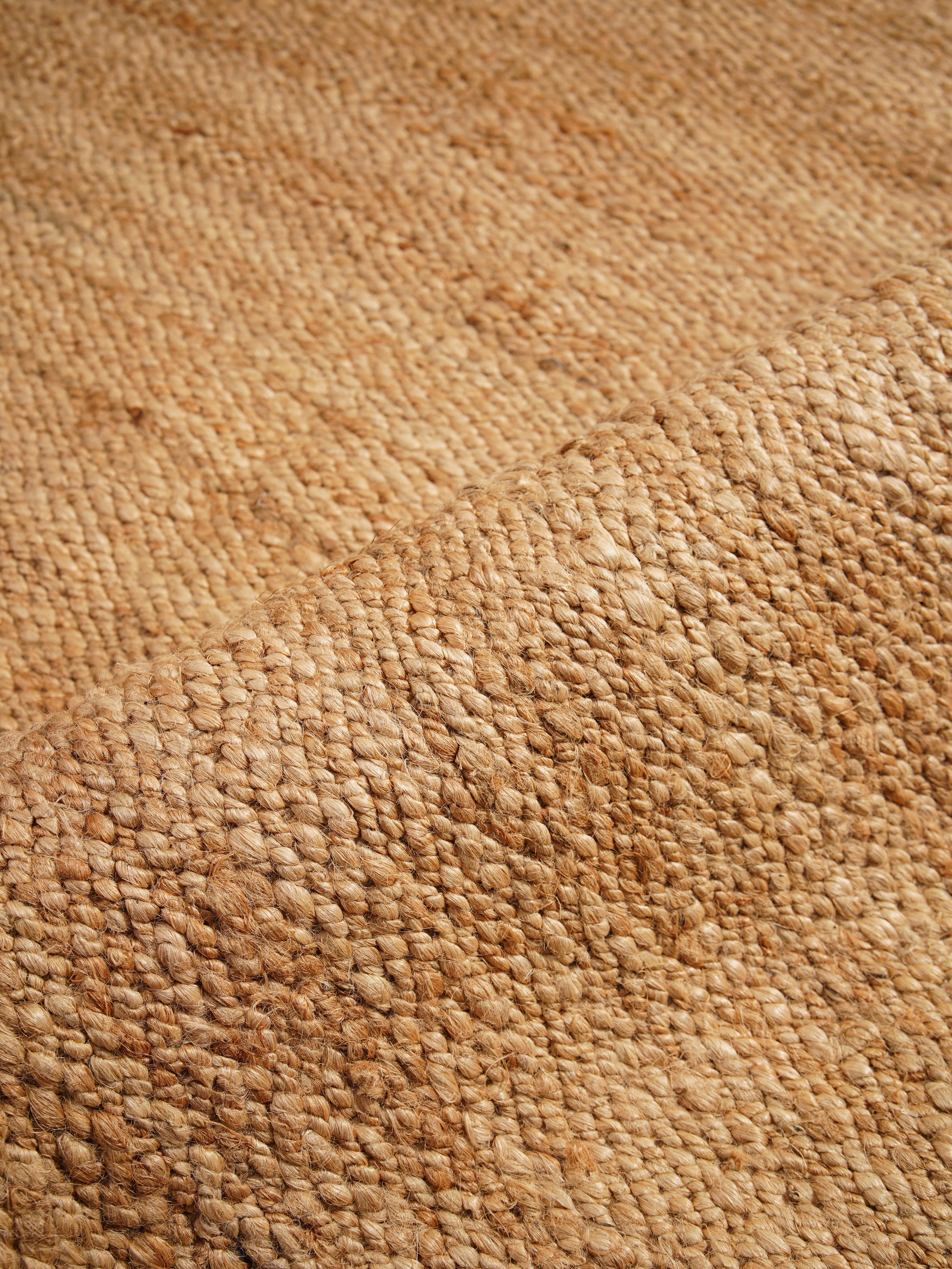 Detail of braided weave pattern on natural jute rug

